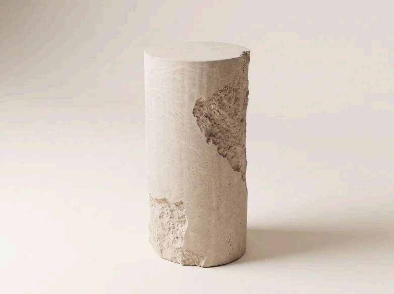 CIVITAS LÁPIS MONOLITH side table, a plain cast concrete cylinder with a raw-fractured face, Avorio finish.